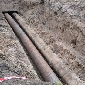 water pipeline, pair of pipe, ground trench torn up by utilities for repair